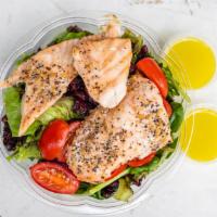 Grilled Salmon Salad · Mesclun greens, cranberries, grape tomatoes, and grilled salmon topped with lite lemon dress...