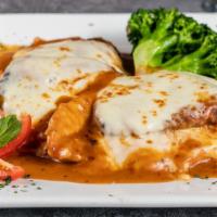 Entrée Sorrentino · Chicken or veal layered with sliced prosciutto, battered eggplant, and melted mozzarella in ...