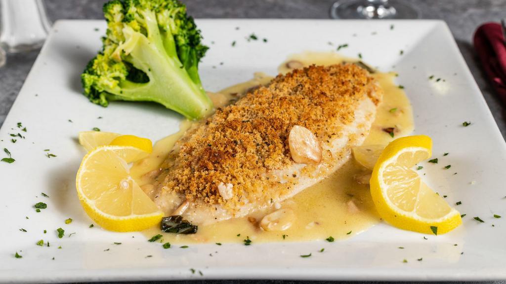 Entrée Tilapia Oreganata · Fresh tilapia topped with our homemade seasoned breadcrumbs, broiled in a white wine a garlic scampi sauce.