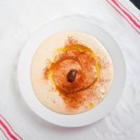 Hummus · Dip made of garbanzo beans, lemon juice, garlic, milk,cumin, olive oil, tahini and olive wit...