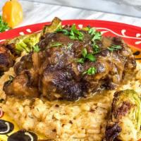 Jamaican Oxtail Plate · 6-hour braised oxtail in a stew of Jamaican spices, vegetables and the spirits of the ancest...