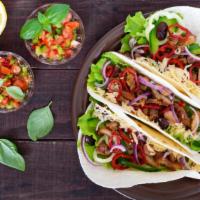 Chicken Tacos · Fresh grilled juicy chicken topped with crisp lettuce, diced fresh tomatoes, our house cilan...
