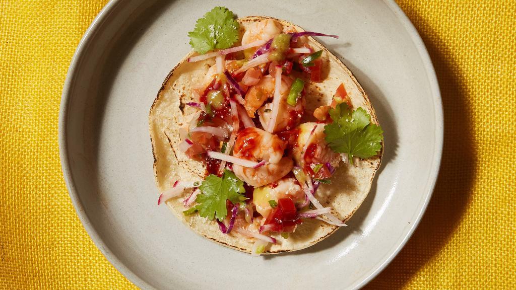 Chile Shrimp Taco · Fragrant garlic shrimp served with onions, cilantro and your choice of salsa.