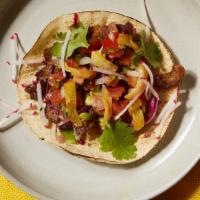 Al Pastor Taco · The ultimate street taco. Thinly sliced, marinated heritage pork served with cilantro, onion...