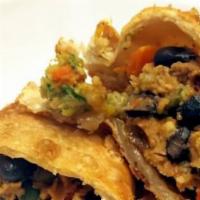 Fiesta Empanada · Black beans, yellow corn, green peppers, and onions, sun-dried tomatoes, and fresh Mozzarell...