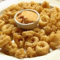 Calamari · Tossed over spicy cornmeal, chipotle aioli