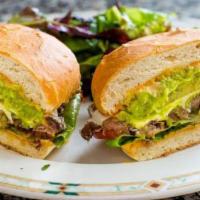Torta De Carnitas · Tortas are traditional Mexican sandwiches on a home-made roll. Pineapple, Oaxaca cheese, and...