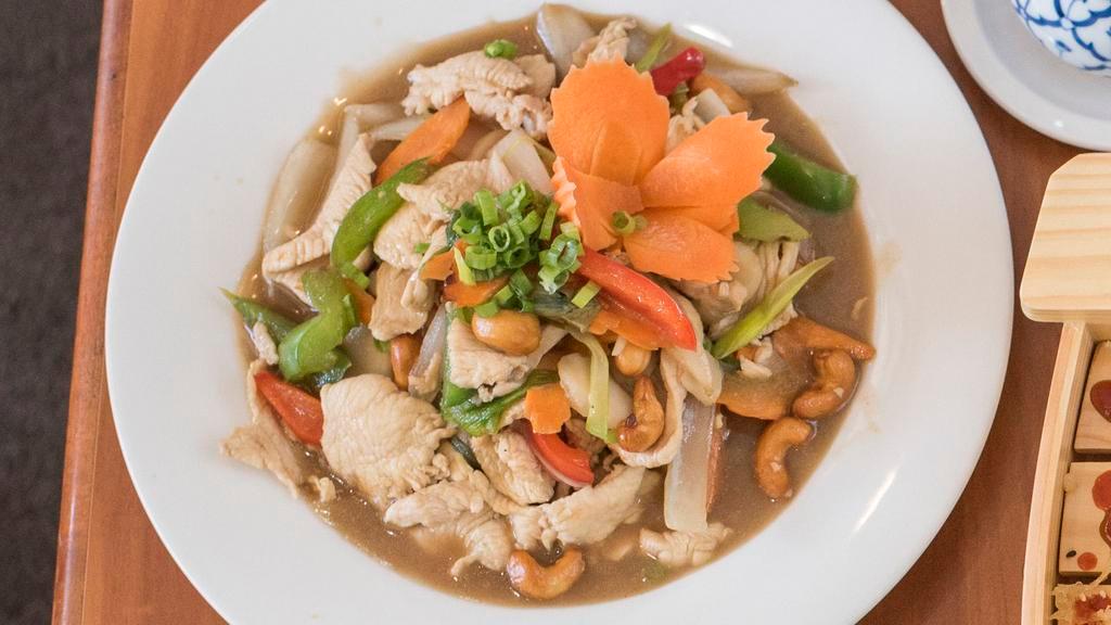 Green Curry · Hot and spicy. Your choice of protein sautéed with mushrooms, bamboo shoots, chili peppers, and basil in spicy Thai green curry and coconut milk. Served with rice.