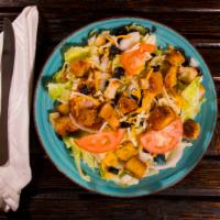 Chef Salad · Lettuce, tomato, onion, cheddar jack cheese, croutons and black olives.