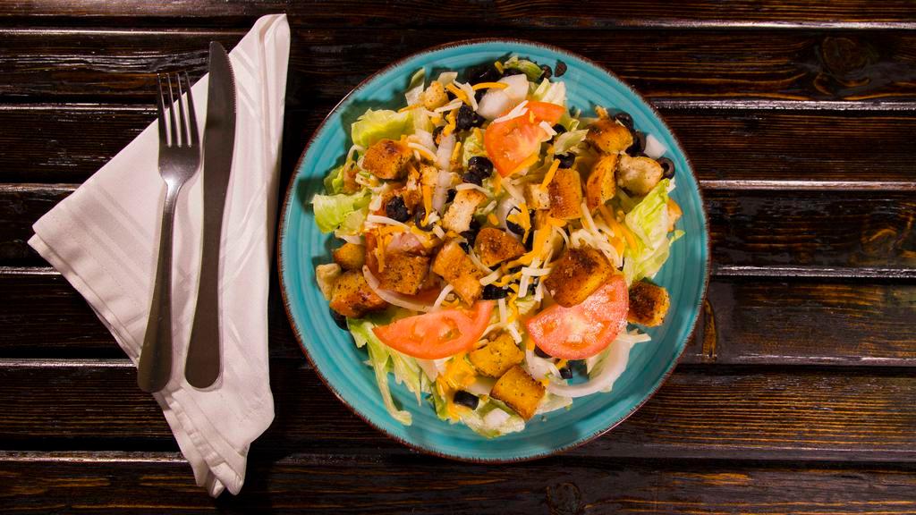 Chef Salad · Lettuce, tomato, onion, cheddar jack cheese, croutons and black olives.