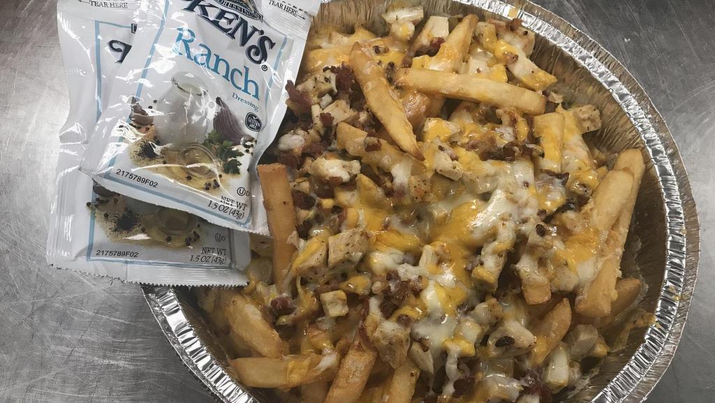 Loaded Fries · Bacon and cheddar jack cheese served with a side of sour cream.