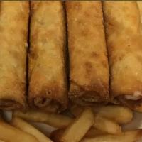 Pizza Logs · Five pizza logs with fries and pizza sauce.