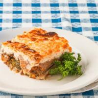 Moussaka · Baked eggplant, potatoes, zucchini and ground beef topped with béchamel sauce. Served with a...