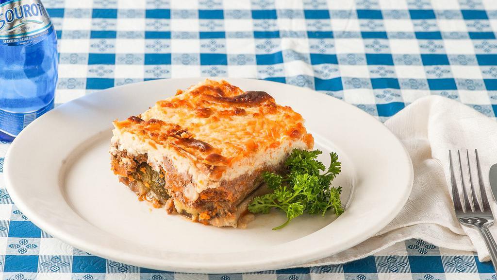 Moussaka · Baked eggplant, potatoes, zucchini and ground beef topped with béchamel sauce. Served with a cup of soup, tossed salad or Greek salad and your choice of a side.