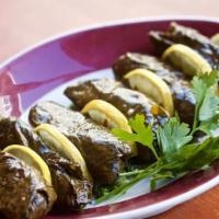 Stuffed Grape Leaves (V) (6 Pieces) · Grape leaves, stuffed with rice, onion, tomato, parsley and spices.