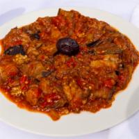 Eggplant With Tomato Sauce · Fried eggplant in our special homemade tomato sauce.