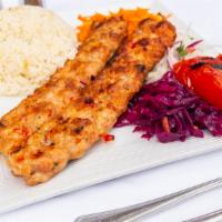 Chicken Adana · Chopped chicken flavored with fresh bell peppers, gently spiced paprika and char-grilled on ...