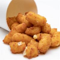 Wisconsin Cheddar Cheese Curds · Deliciously Fried Wisconsin Cheddar Cheese Curds. WARNING! They are addictive.