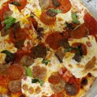 Cacciatore Pizza · Pepperoni, sausage, ham, home made meatballs, classic tomato sauce, fresh mozzarella.