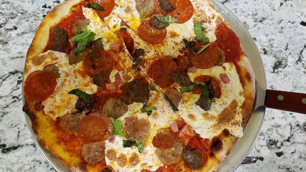 Cacciatore Pizza · Pepperoni, sausage, ham, home made meatballs, classic tomato sauce, fresh mozzarella.
