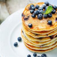 Blueberry Pancakes · Fluffy blueberry buttermilk pancake stack