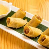 Pochana Spring Roll · Seasoned vermicelli with cabbage, taro, and carrot in rice paper, plum dipping sauce. ￼￼.