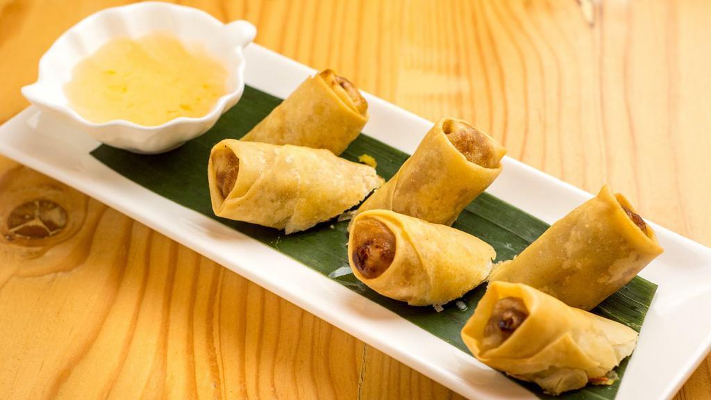 Pochana Spring Roll · Seasoned vermicelli with cabbage, taro, and carrot in rice paper, plum dipping sauce. ￼￼.