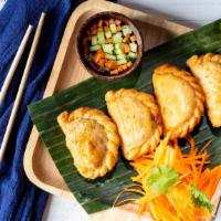 Curry Puff · Puff pastry filled with onion chicken & curried potato.