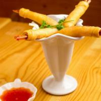 Shrimp Crisps · Deep fried shrimp rolls and honey chilli sauce.