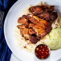 Fried Chicken Over Steamed Ginger Rice · Marinated chicken leg on steamed ginger rice Serve with house-made sweet chili sauce.