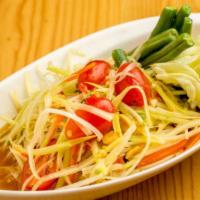 Som Tum · Classic Thai green papaya salad toasted with long bean, cherry tomato, garlic, bird's eye ch...