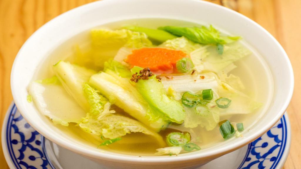 Vegetable Ginger Soup · Assorted vegetables in clear broth.