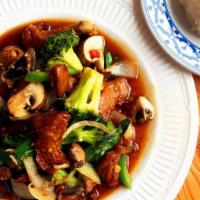 Mock Duck Basil · Wok-fried with pepper, onion, garlic broccoli, mushroom & spicy basil sauce.