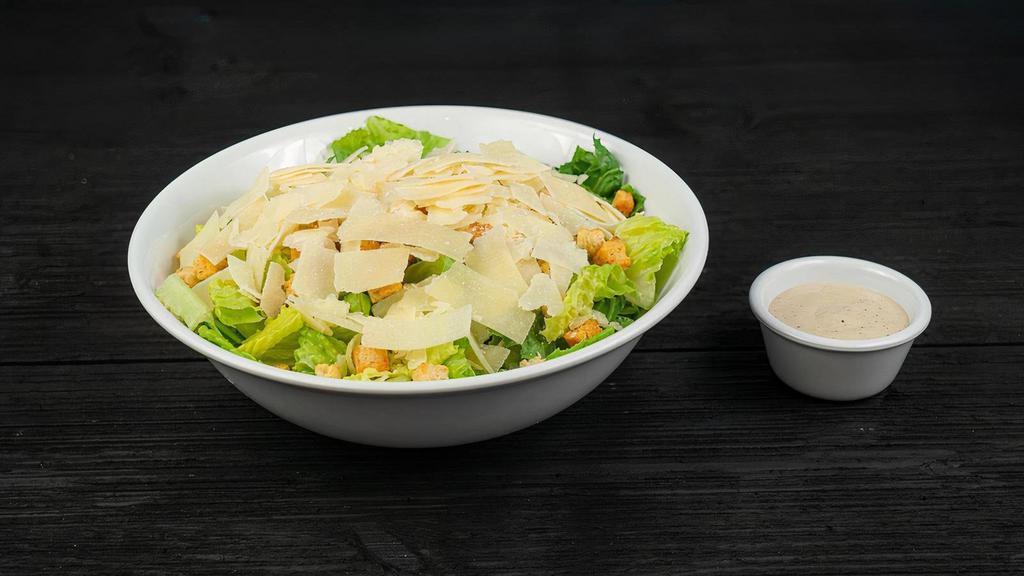 Large Caesar Salad · romaine lettuce, shaved parmesan and croutons served with Caesar or your choice of dressing