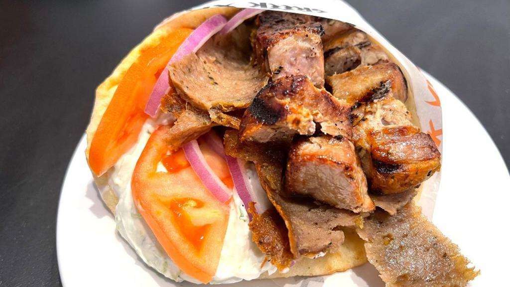 Combo Pita · choice of 2 proteins and served with tomatoes, red onions and tzatziki all wrapped inside a toasted regular pita