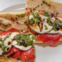 Tuscany Chicken · Golden Fried or Grilled Chicken Cutlets, Roasted Red Peppers, Fresh Mozzarella, Basil topped...