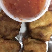 Fried Dumplings · 4 pieces. Ground chicken, shrimp, pork, mushroom, and sweet chili sauce.