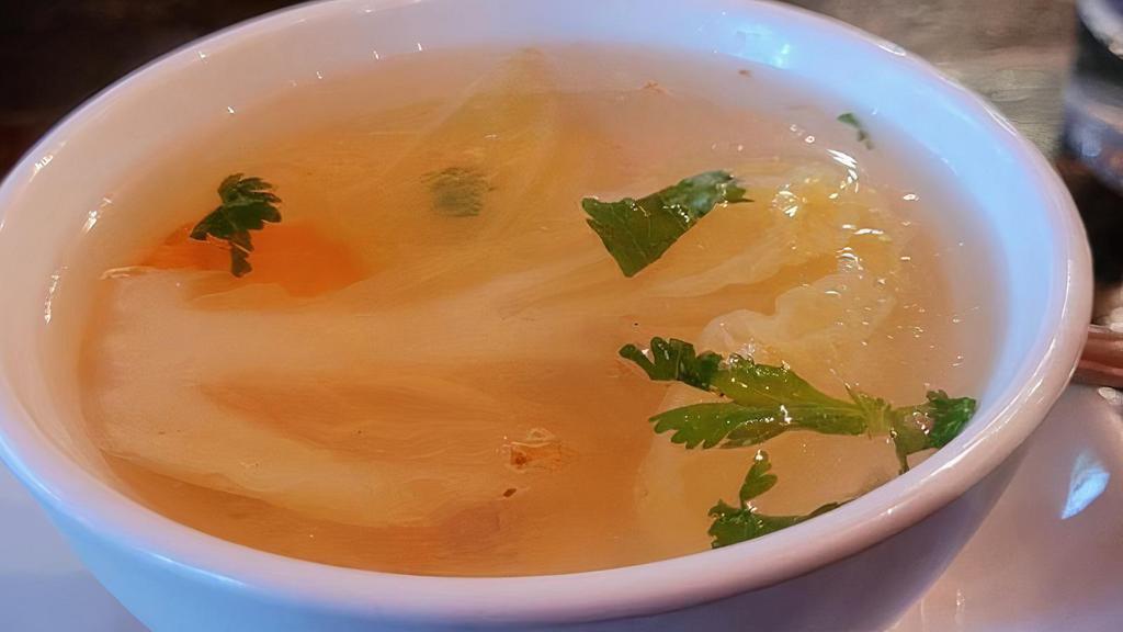 Vegetable Soup · Homemade clear soup with fresh onion, carrot, napa, celery, and garlic oil.