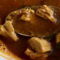 Chicken Soup · Scrumptious Indian style chicken soup with different garnishes.