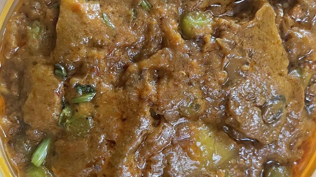 Baingan Bharta · Mashed eggplant cooked in savory spices and green peas.