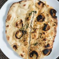 Garlic Naan · Refined flour bread stuffed with fresh chopped garlic aromatic herbs.