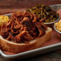 Carolina Pulled Pork · Pork Smoked & Pulled Off the Bone & Tossed in our Famous Vinegar BBQ Sauce.