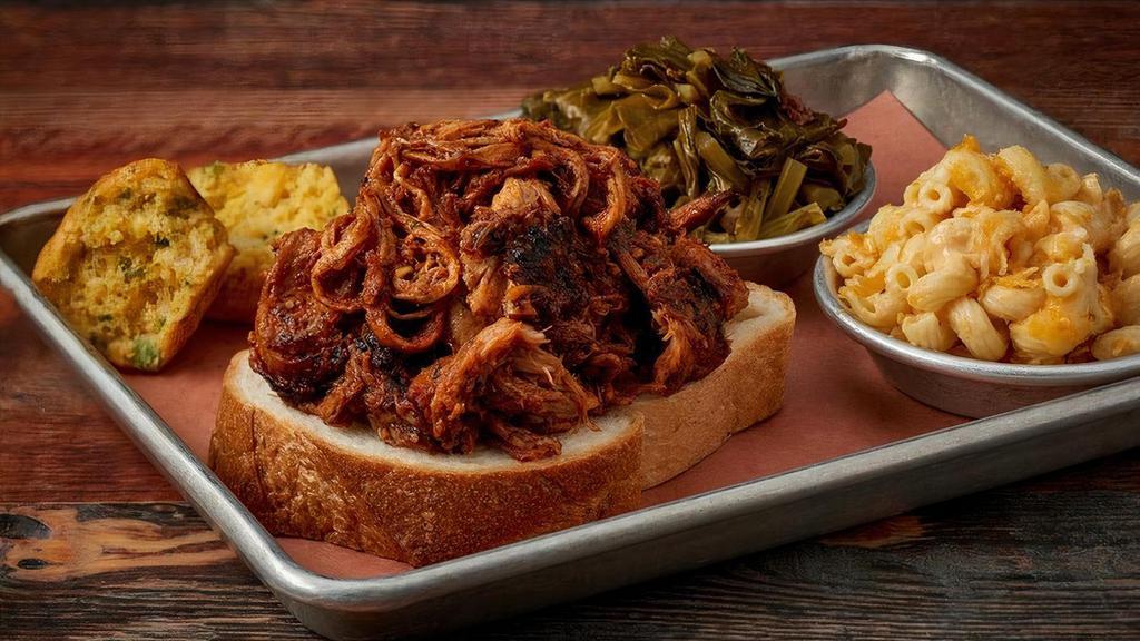 Carolina Pulled Pork · Pork Smoked & Pulled Off the Bone & Tossed in our Famous Vinegar BBQ Sauce.