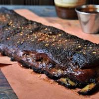 Whole Rack Memphis Style Pork Spare Ribs · Approx 8-10 Pieces of our Dry Rubbed & Hickory Smoked Ribs