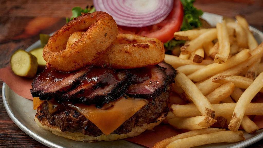 Virgil'S Bbq Burger · Grilled 8 Oz. Certified Black Angus Burger Dusted in Our Spice Rub & Topped with Cheddar Cheese, Smoked Brisket, Onion Rings & Hickory BBQ Sauce