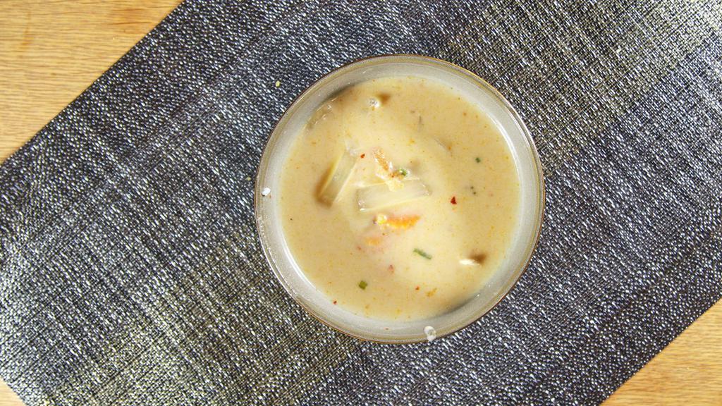 Tom Kha Chicken · Choice of shrimp, chicken or vegetable coconut soup seasoned with aromatic galangal, lime juice, and hot chilies.