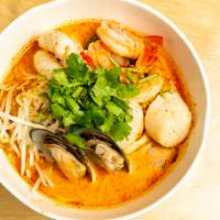 Tom Yum Creamy Soup · Rice Noodle in a creamy spicy broth with mixed seafood.