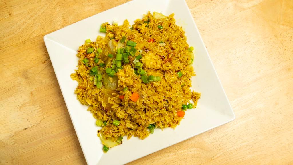 Pineapple Fried Rice · Pineapple, onion, scallions, and egg.