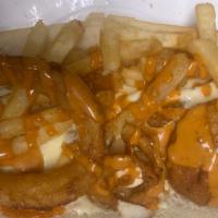 Fat Bro · Grilled or breaded chicken cutlet, pepperjack cheese, onion rings, fries and chipotle sauce.