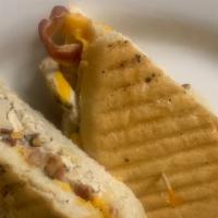 Lovey'S Panini · Grilled or breaded chicken cutlet, bacon, potatoes, red onion, cheddar cheese and ranch dres...